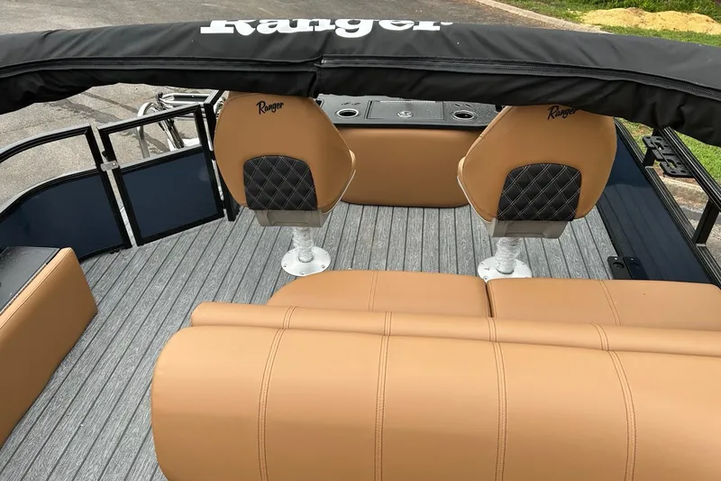 Slide: The Image of 2026 Ranger 223F boat interior with tan seating and black accents. - 5