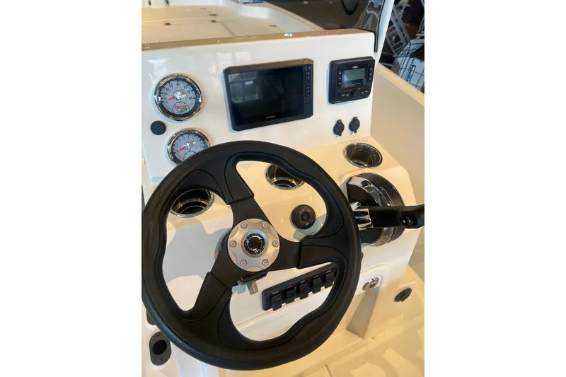 Slide: The Image of Steering console of 2026 Mako Pro Skiff 19 CC with gauges and controls. - 6