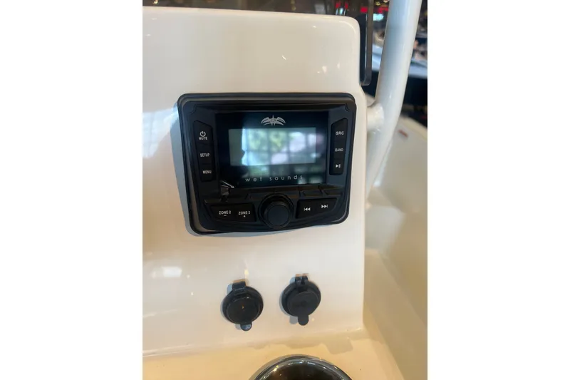 Slide: The Image of Control panel of 2026 Mako Pro Skiff 19 CC boat with audio system. - 8