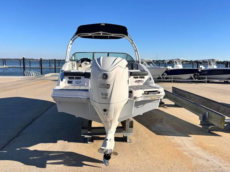 Slide: The Image of Chaparral 23 SSi OB 2022 boat at dock with outboard motor. - 4