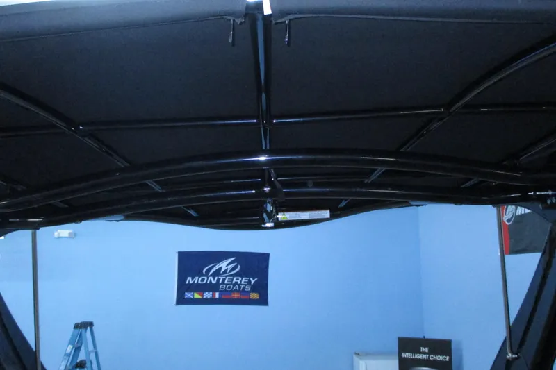 Slide: The Image of 2018 Chaparral 287 SSX boat canopy with Monterey Boats banner in background. - 11