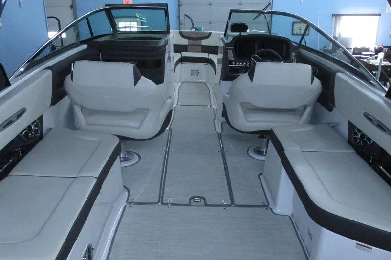 Slide: The Image of 2018 Chaparral 287 SSX boat interior with seating and steering console. - 5