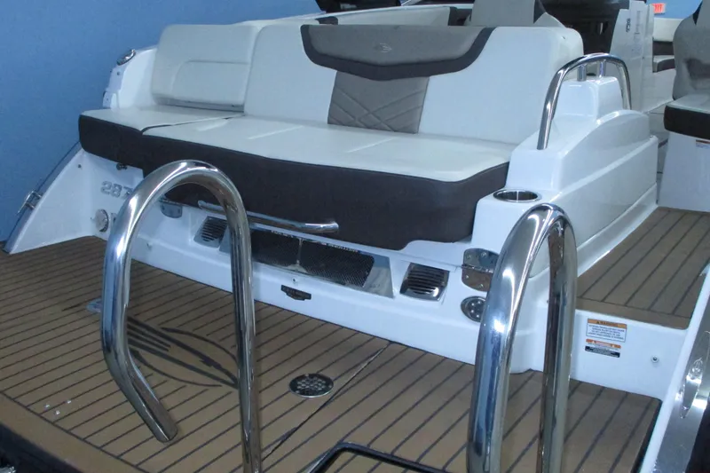 Slide: The Image of 2018 Chaparral 287 SSX boat with sleek seating and stainless steel railings. - 6