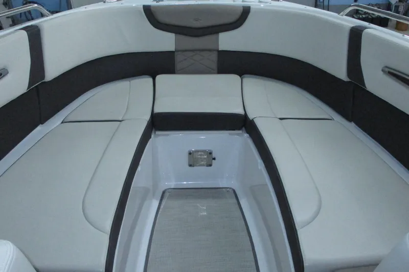 Slide: The Image of 2018 Chaparral 287 SSX boat interior with cushioned seating and modern design. - 8
