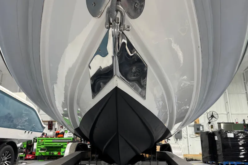 Slide: The Image of 2010 Cobra Ribs Nautique 8.6m boat hull in a workshop setting. - 20