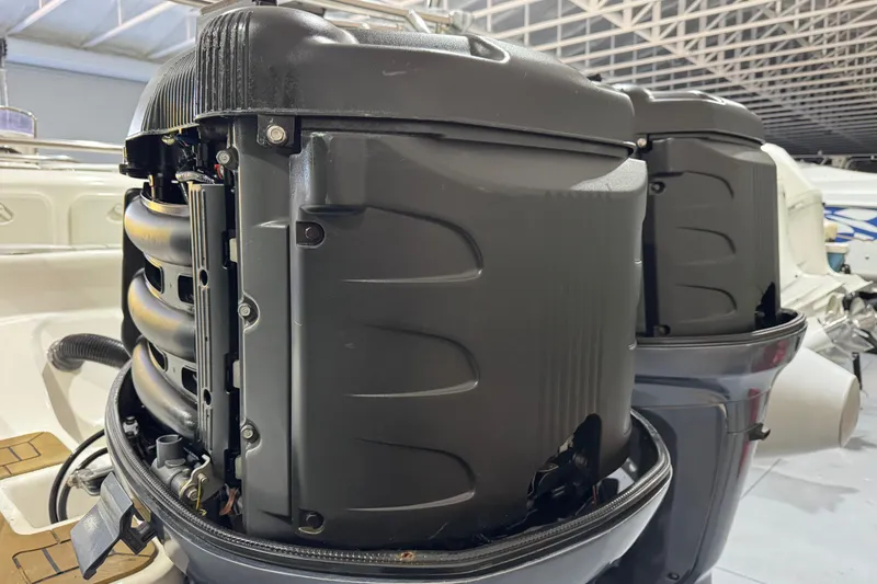 Slide: The Image of 2010 Cobra Ribs Nautique 8.6m boat engine detail in a warehouse setting. - 27