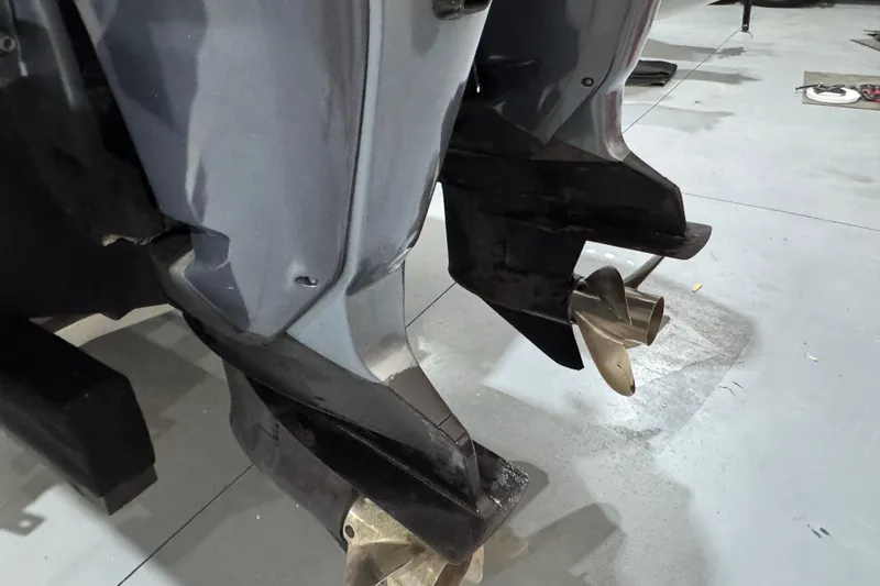 Slide: The Image of Close-up of Cobra Ribs Nautique 8.6m 2010 boat propellers in a workshop. - 28