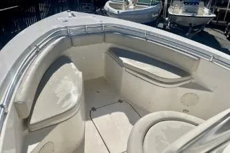 Slide: The Image of 2019 Cobia 237 Center Console boat interior with seating and storage compartments. - 8