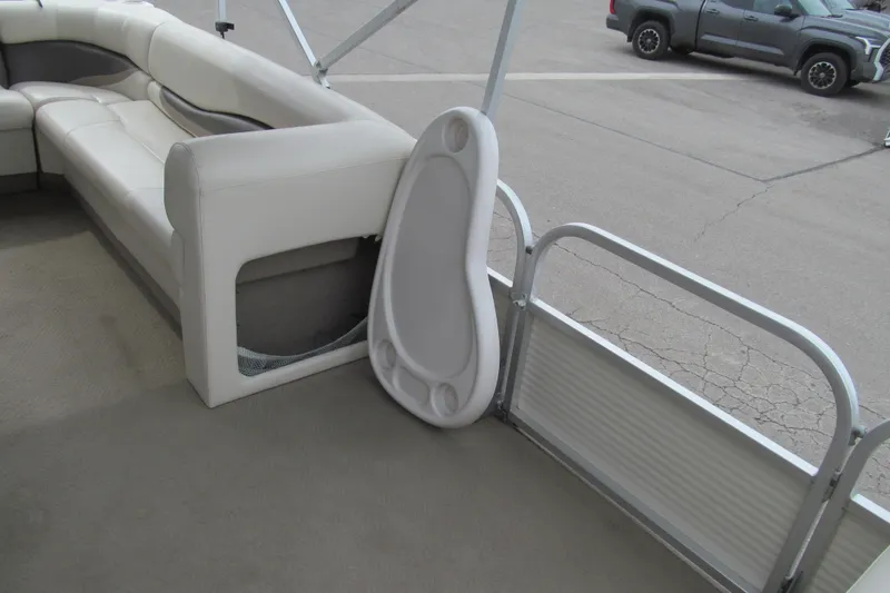 Slide: The Image of 2008 Sun Tracker Party Barge 25 I/O Regency Edition interior with white seating and table. - 11