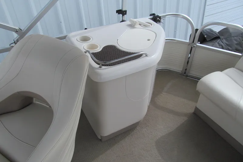 Slide: The Image of 2008 Sun Tracker Party Barge 25 I/O Regency Edition interior with seating and console. - 13