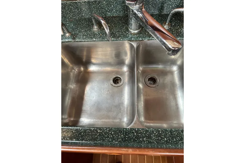 Slide: The Image of Stainless steel double sink with chrome faucet on speckled countertop, Outbound 44, 2000 model. - 57