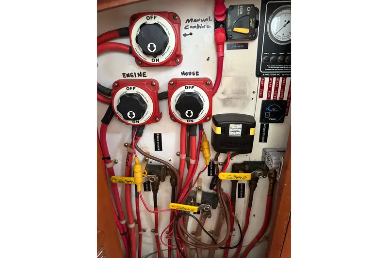 Slide: The Image of Electrical panel with switches and wiring on a 2000 Outbound 44 yacht. - 58