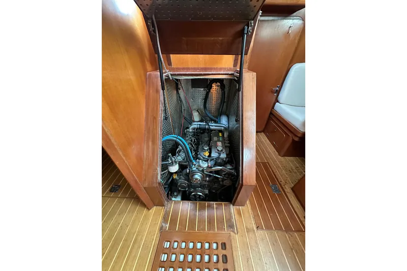 Slide: The Image of Engine compartment of a 2000 Outbound 44 sailboat, showcasing detailed mechanical components. - 60