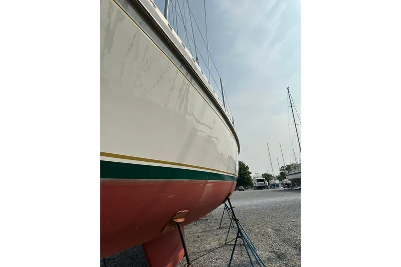 Slide: The Image of Outbound 44 sailboat from 2000 on dry dock, side view. - 71