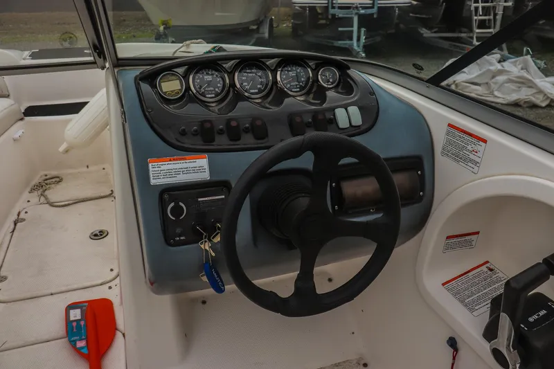 Slide: The Image of 2006 Yamaha Boats SX210 dashboard with steering wheel and control panel. - 10