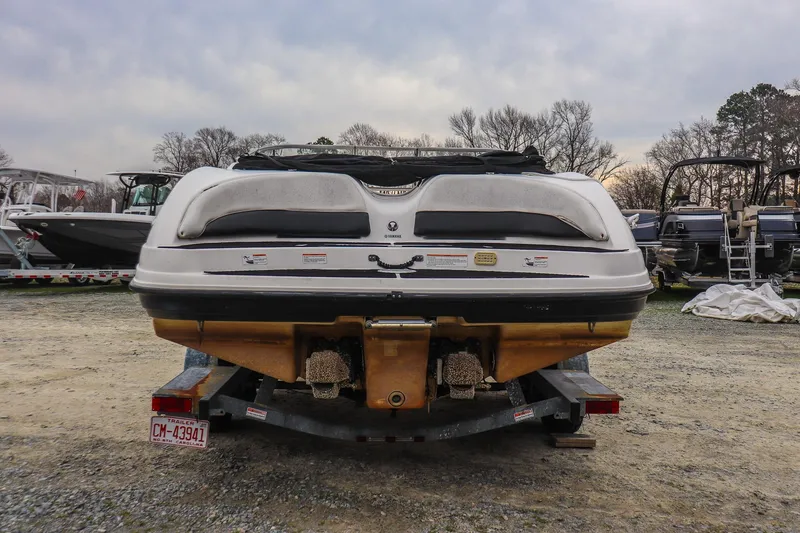 Slide: The Image of Rear view of a 2006 Yamaha Boats SX210 on a trailer in a boatyard. - 3