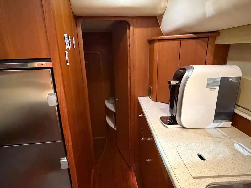 Slide: The Image of Interior of 2008 Tiara Yachts 4300 Sovran with kitchen and coffee maker. - 19