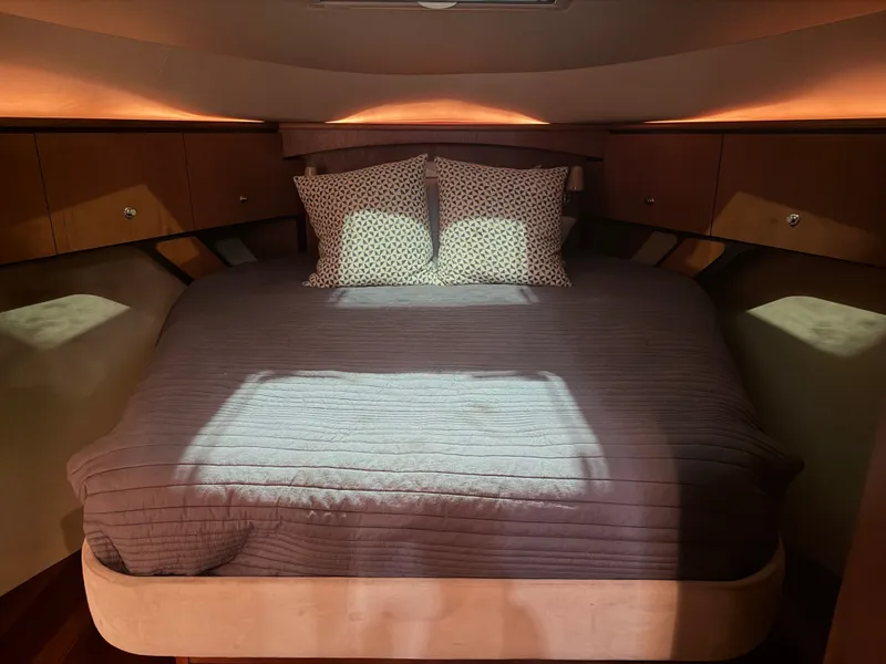 Slide: The Image of Luxurious bedroom in a 2008 Tiara Yachts 4300 Sovran. - 25