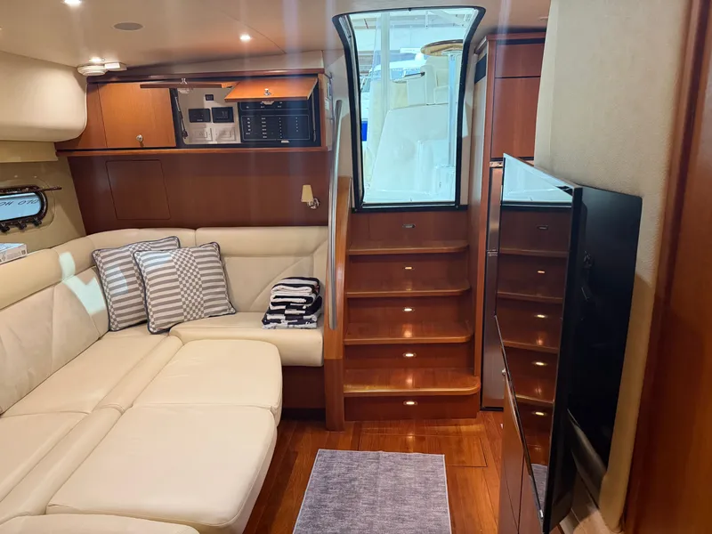 Slide: The Image of Interior of 2008 Tiara Yachts 4300 Sovran with leather sofa and wooden stairs. - 28