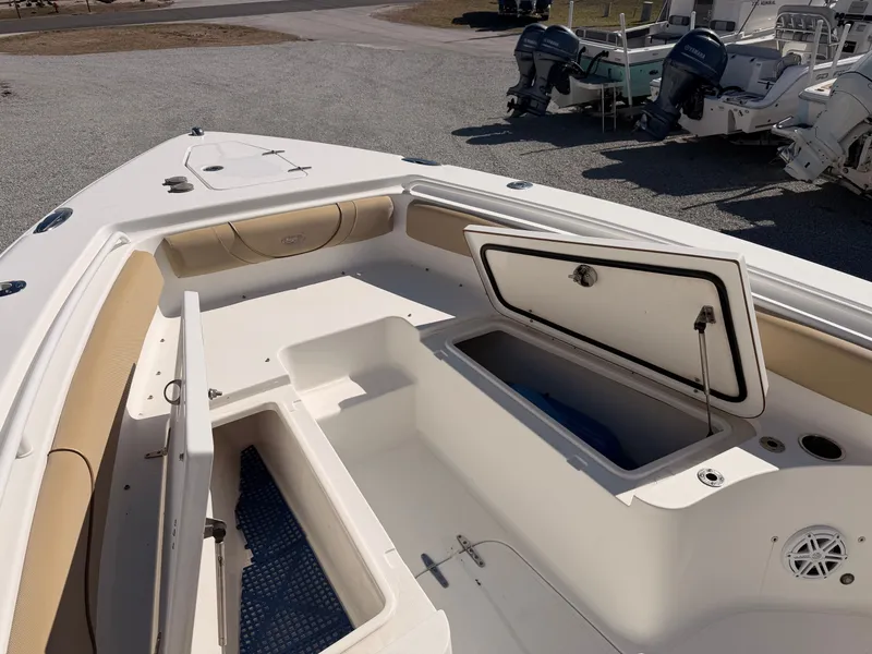 Slide: The Image of 2016 Sea Hunt Gamefish 27 with open storage compartments in the bow area. - 11