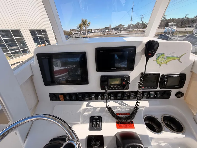 Slide: The Image of 2016 Sea Hunt Gamefish 27 boat console with electronics. - 17