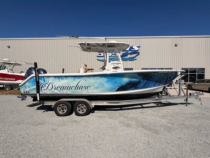 Slide: The Image of 2016 Sea Hunt Gamefish 27 boat with "Dreamchase" design on trailer. - 2