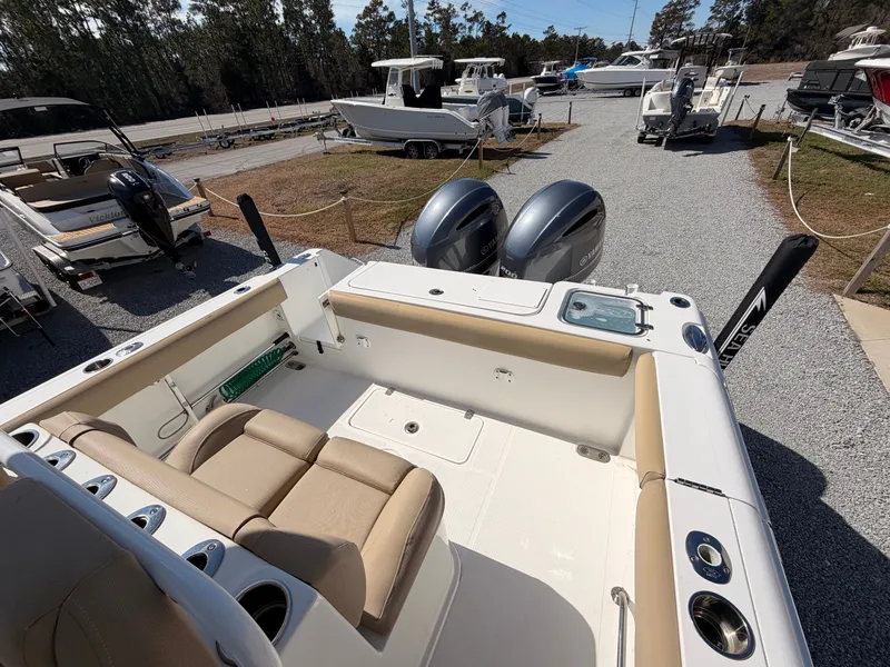 Slide: The Image of 2016 Sea Hunt Gamefish 27 with dual outboard engines at dock. - 20