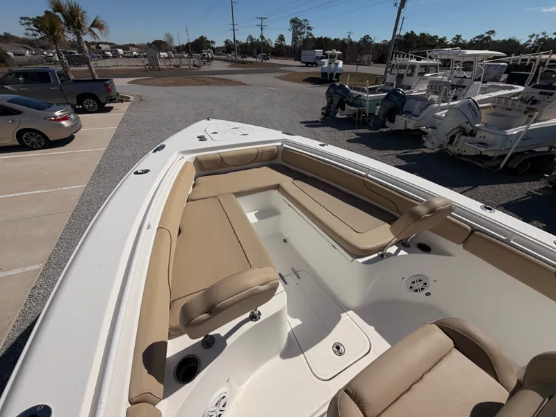 Slide: The Image of 2016 Sea Hunt Gamefish 27 with beige seating at the marina. - 22