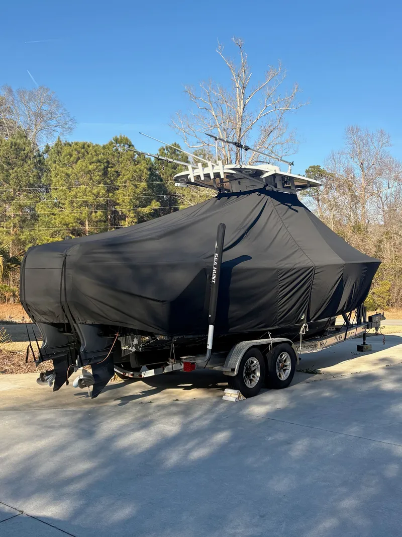 Slide: The Image of 2016 Sea Hunt Gamefish 27 boat covered on trailer. - 29