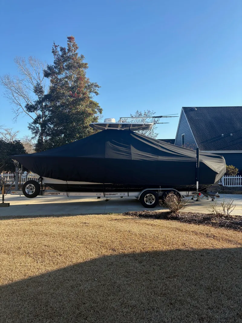 Slide: The Image of 2016 Sea Hunt Gamefish 27 boat covered on trailer. - 30