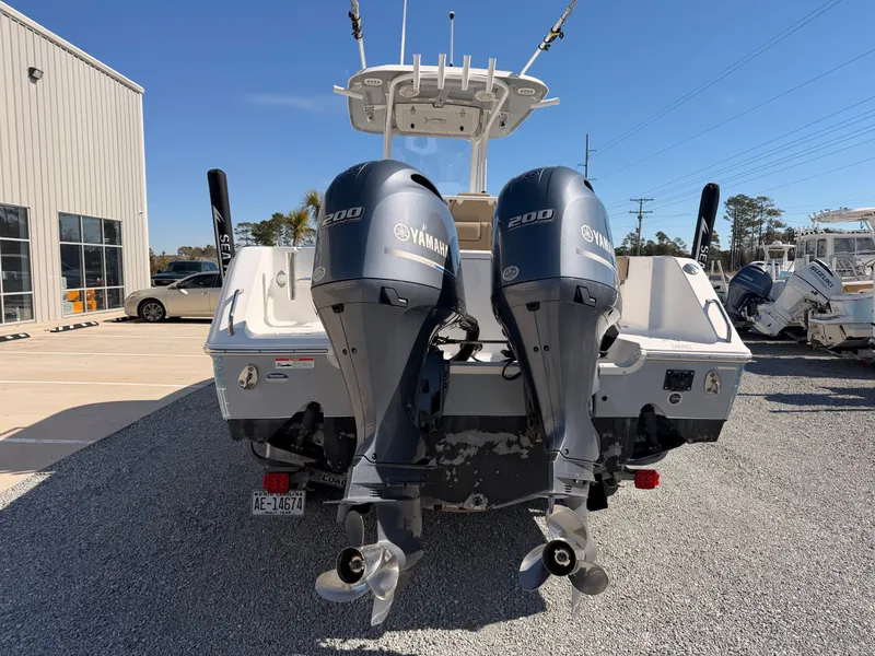 Slide: The Image of 2016 Sea Hunt Gamefish 27 with Yamaha engines outdoors. - 7