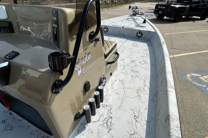 Slide: The Image of 2026 Skuta 24 Vista boat with marble-patterned deck and fishing rod holders. - 14