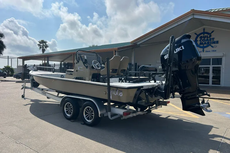 Slide: The Image of 2026 Skuta 24 Vista boat on trailer outside Gulf Coast Marine dealership. - 4
