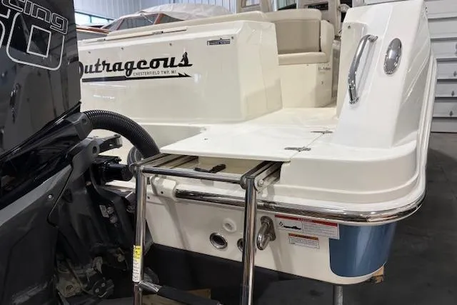 Slide: The Image of 2020 Boston Whaler 330 Outrage boat stern with ladder and engine detail. - 16