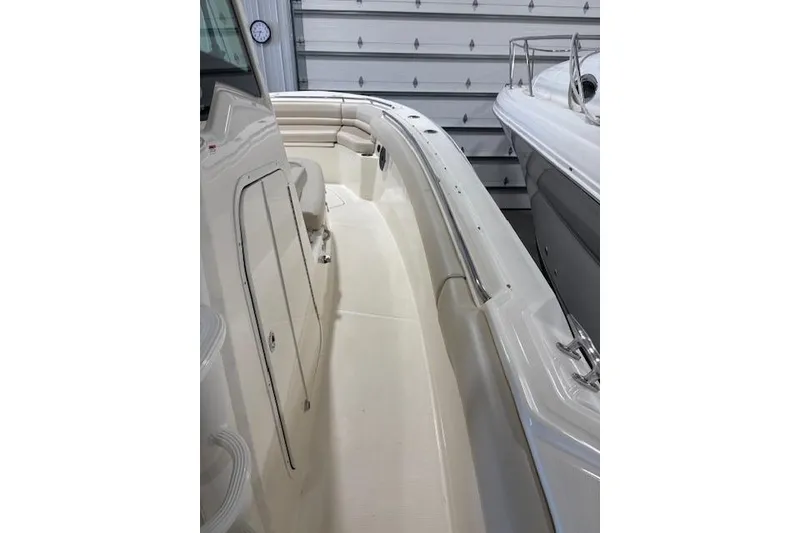 Slide: The Image of 2020 Boston Whaler 330 Outrage boat interior with sleek design and spacious seating. - 27