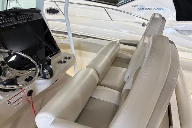 Slide: The Image of 2020 Boston Whaler 330 Outrage interior with helm and seating area. - 33