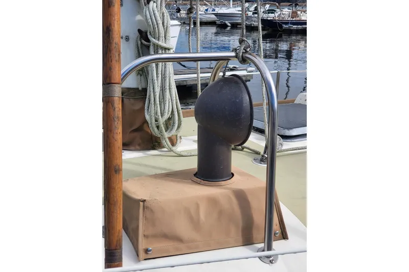 Slide: The Image of 1984 Sea Sprite 34 sailboat deck with vent and ropes at marina. - 15