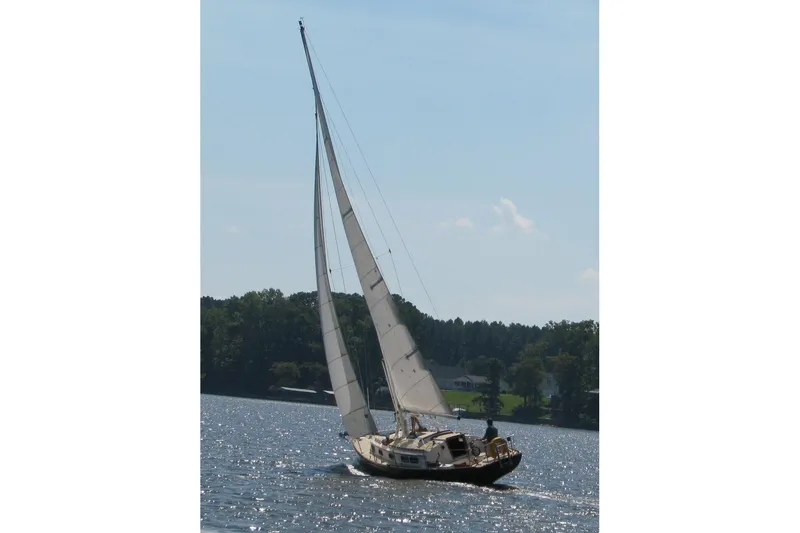 Slide: The Image of Sailing on a lake, 1984 Sea Sprite 34 yacht with full sails, clear sky. - 2