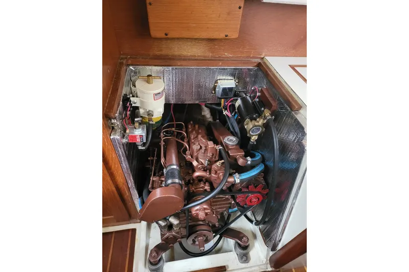 Slide: The Image of Engine compartment of a 1984 Sea Sprite 34 sailboat, showcasing detailed mechanical components. - 30