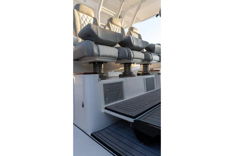 Slide: The Image of 2024 Everglades 395 Center Console boat seating area with luxurious leather seats. - 15