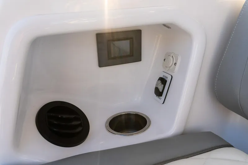 Slide: The Image of 2024 Everglades 395 Center Console interior detail with control panel and cup holder. - 23