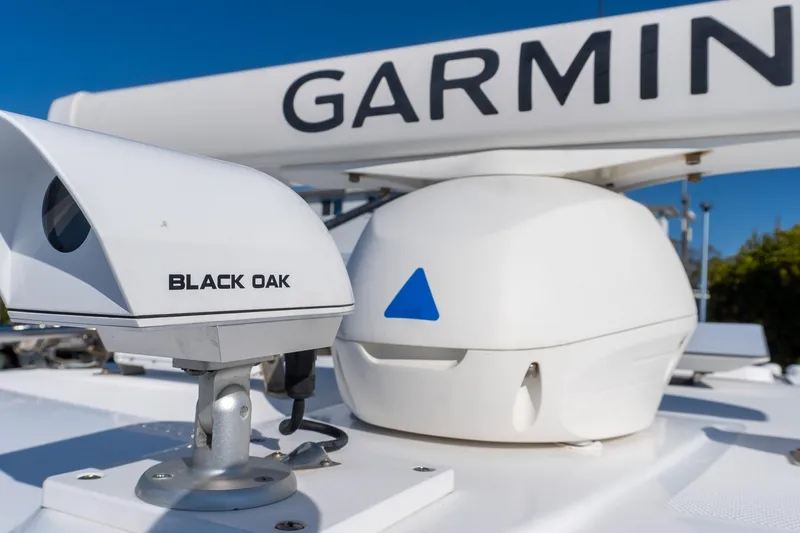 Slide: The Image of 2024 Everglades 395 Center Console with Garmin and Black Oak equipment. - 24