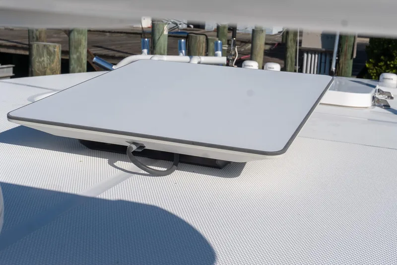 Slide: The Image of 2024 Everglades 395 Center Console with mounted satellite dish on deck. - 27