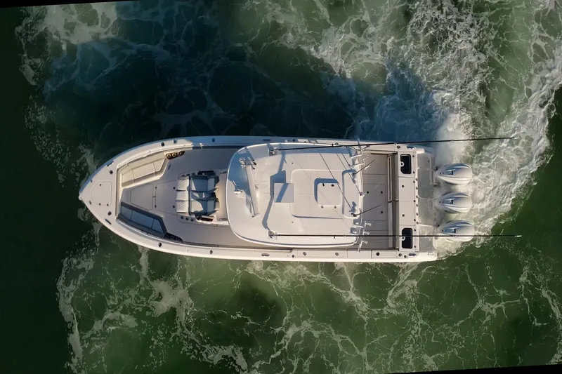 Slide: The Image of Aerial view of 2024 Everglades 395 Center Console boat cruising on water. - 3