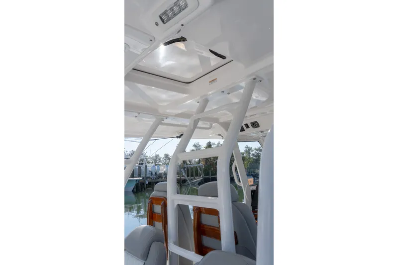 Slide: The Image of Interior view of 2024 Everglades 395 Center Console boat, showcasing seating and structure. - 36