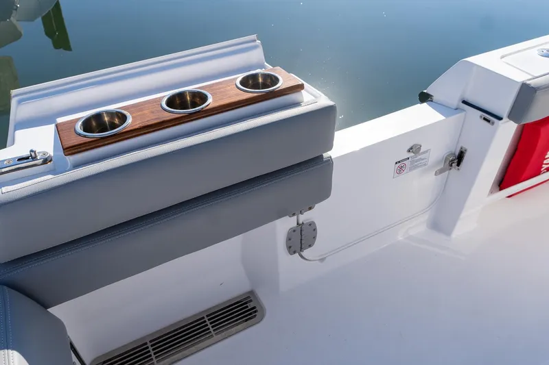 Slide: The Image of 2024 Everglades 395 Center Console boat with cup holders and sleek seating design. - 44
