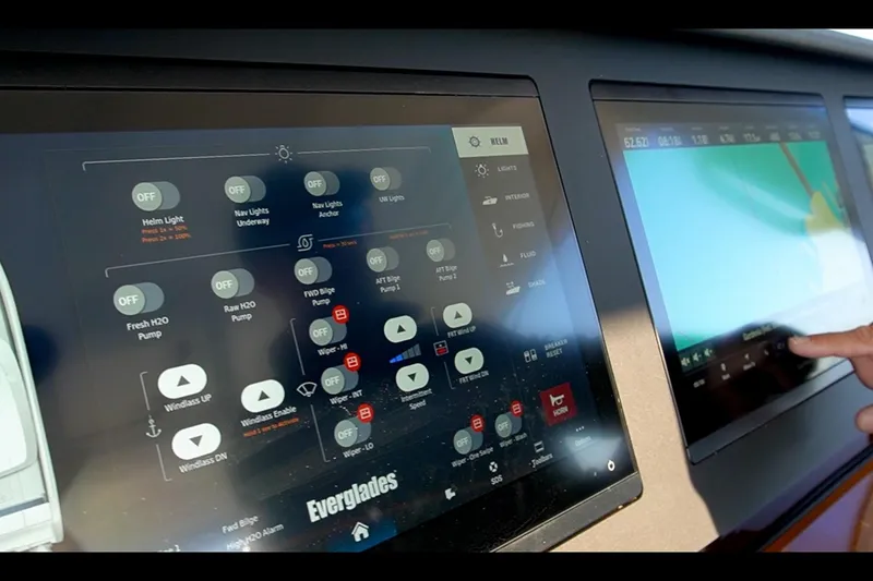 Slide: The Image of Touchscreen controls on 2024 Everglades 395 Center Console boat dashboard. - 49