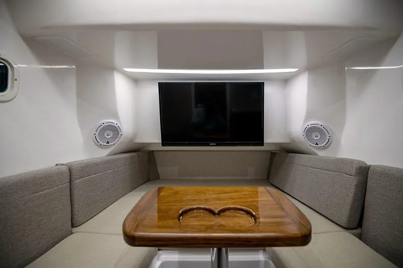 Slide: The Image of Manufacturer Provided Image: Luxurious interior of 2024 Everglades 395 Center Console with TV and seating area. - 51