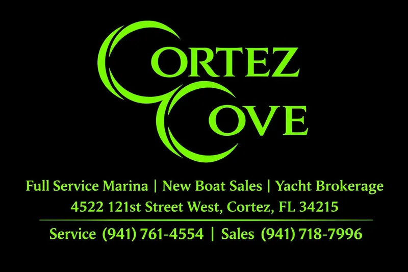 Slide: The Image of Cortez Cove Marina advertisement with contact details and services in bright green text. - 56