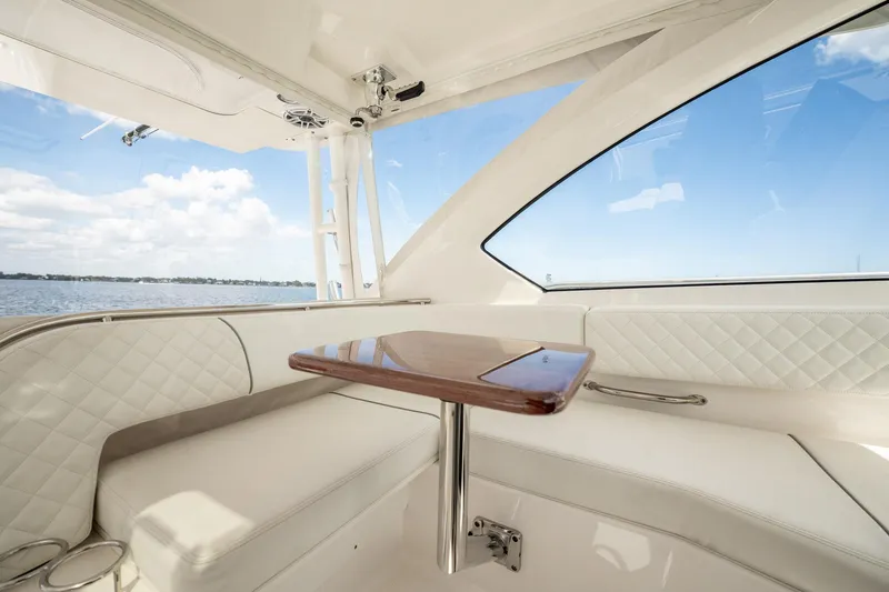 Slide: The Image of Luxurious interior of 2024 Pursuit OS 325 Offshore yacht with elegant seating and ocean view. - 11